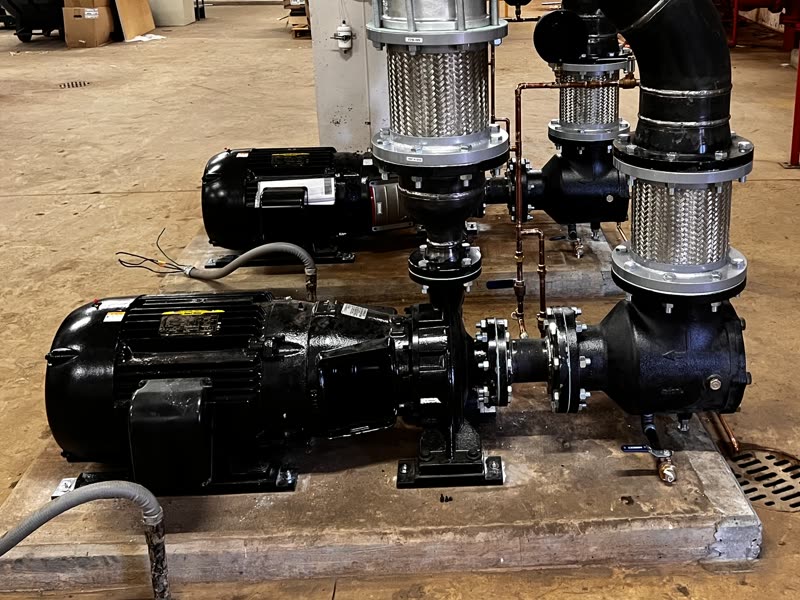 Two centrifugal pumps with electric motors on a concrete base