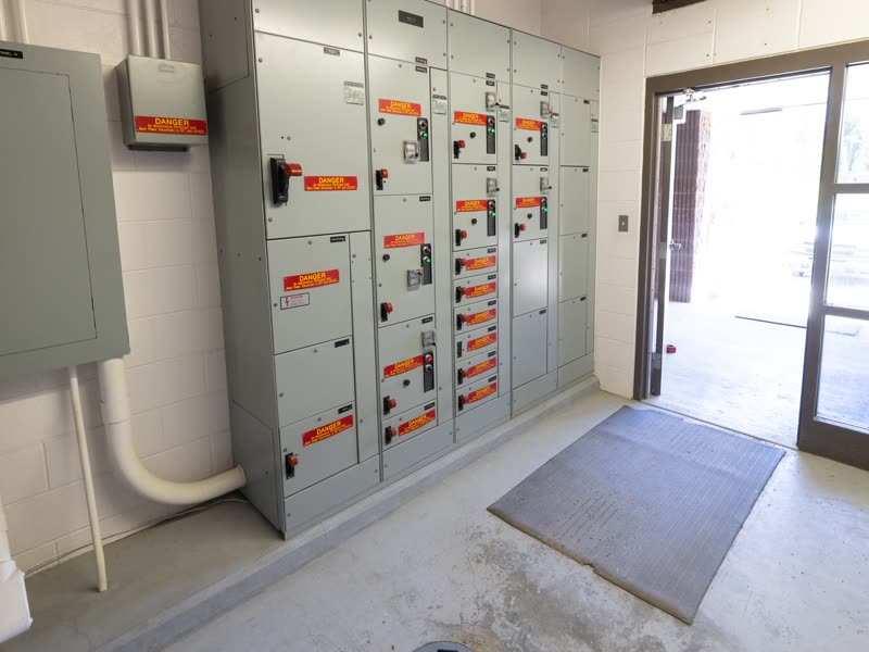 Electrical room with a motor control center panel and starter drawers